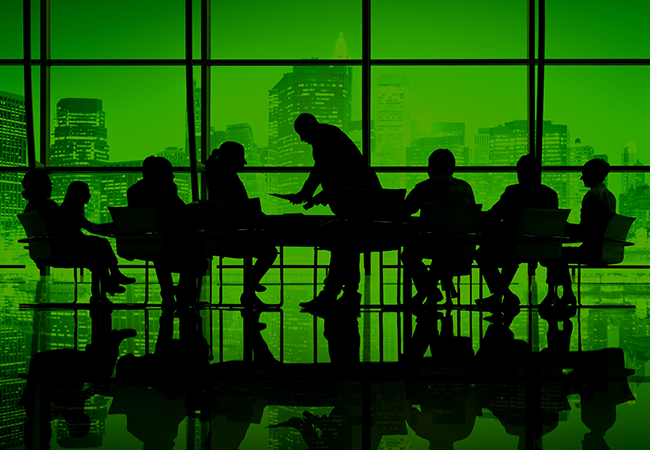 Silhouettes of executives in a boardroom with a city skyline backdrop, symbolizing confidential corporate discussions and data security.