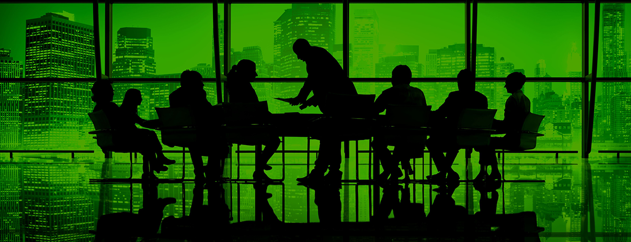 Silhouettes of executives in a boardroom with a city skyline backdrop, symbolizing confidential corporate discussions and data security.